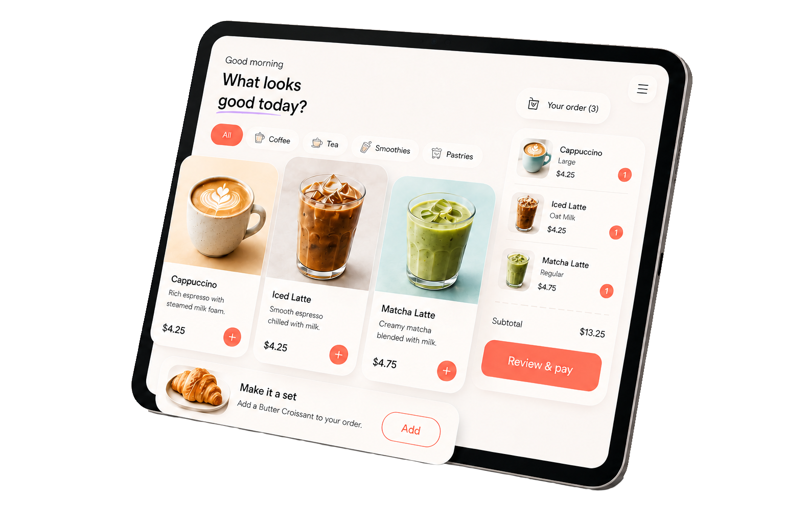 Kiozi running on a tilted iPad: a self-order menu with drinks, a cart, and a Review & pay button